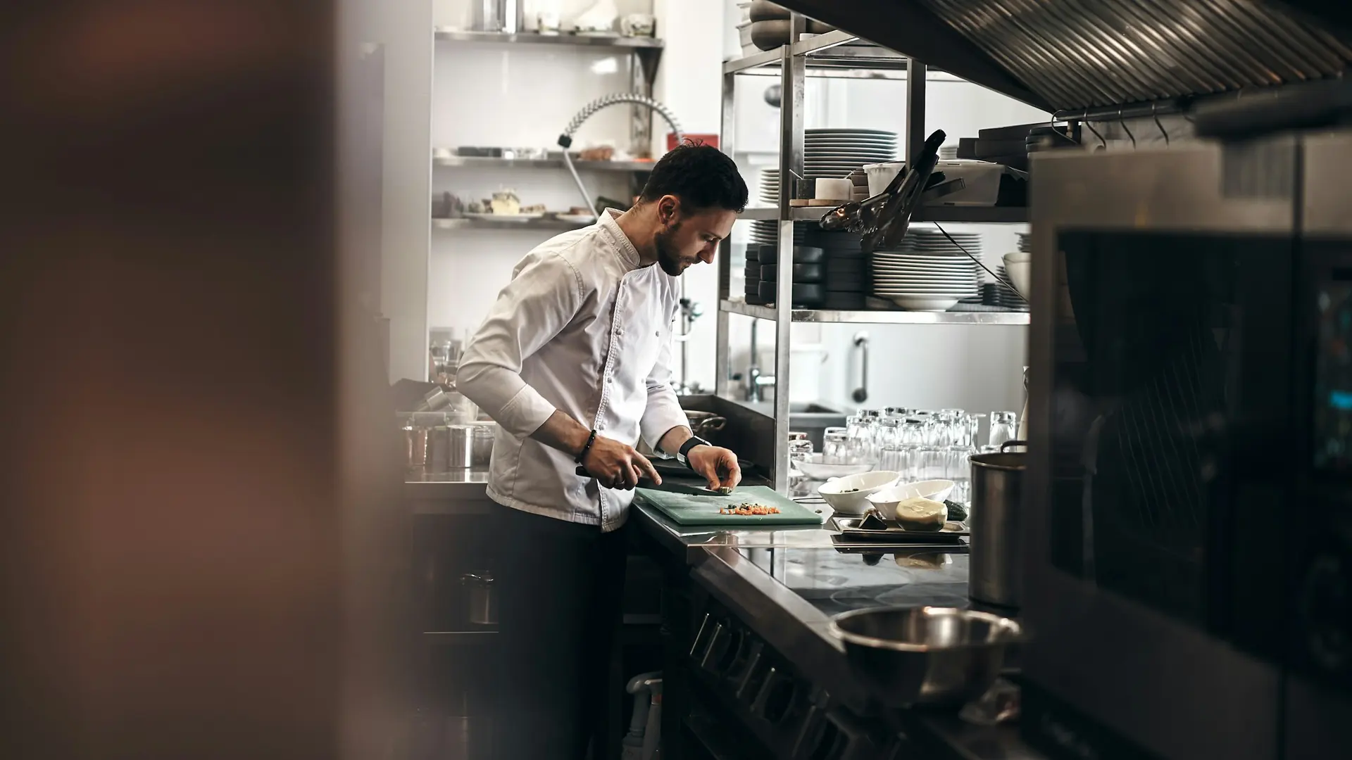 Chef preparing dishes in a professional kitchen