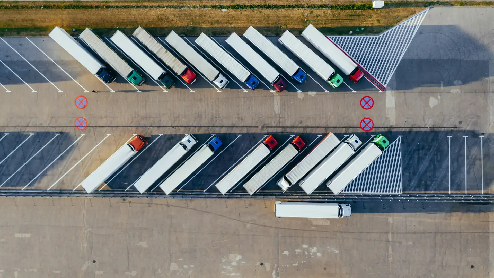 Freight lorries at a distribution depot at dusk