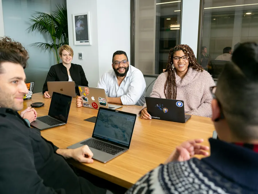 Professional services team in a meeting around a table