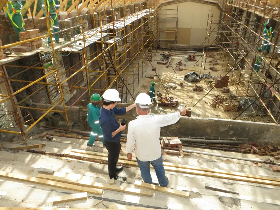Site manager reviewing plans on a construction site