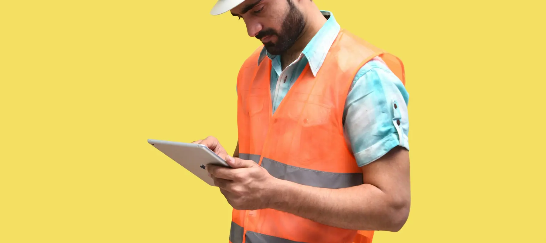 Trades team coordinating work using a tablet on site