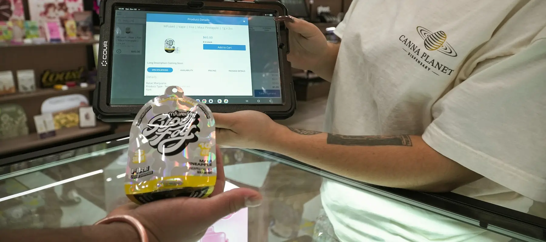 Shopper paying by card at a modern retail counter