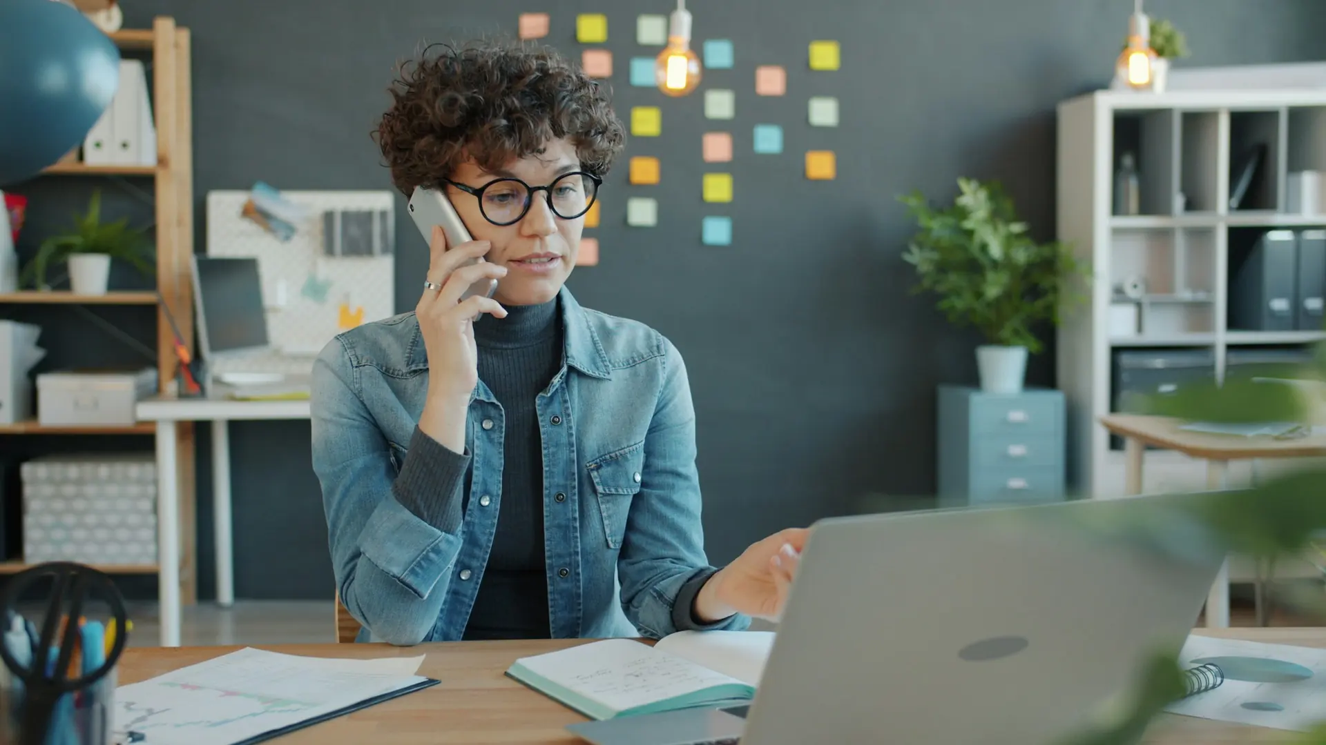 QuicSort team member taking a call with a laptop open