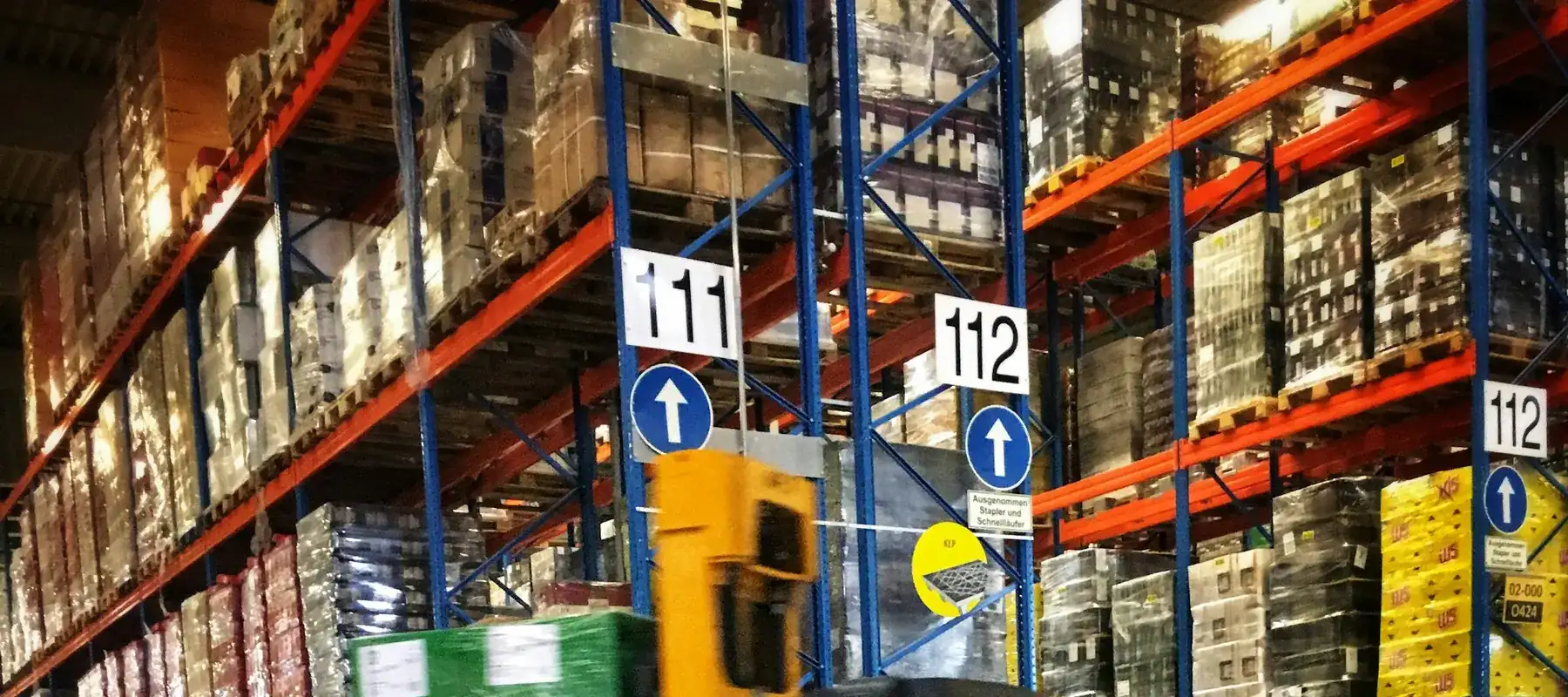 Warehouse staff checking stock levels on a handheld device