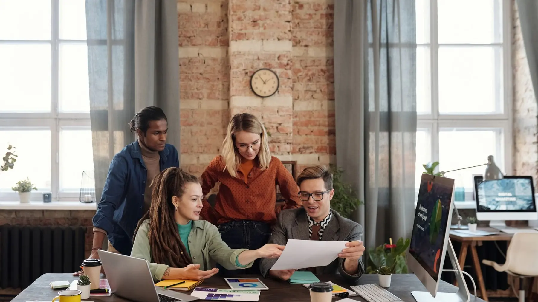 Marketing team reviewing campaign performance together
