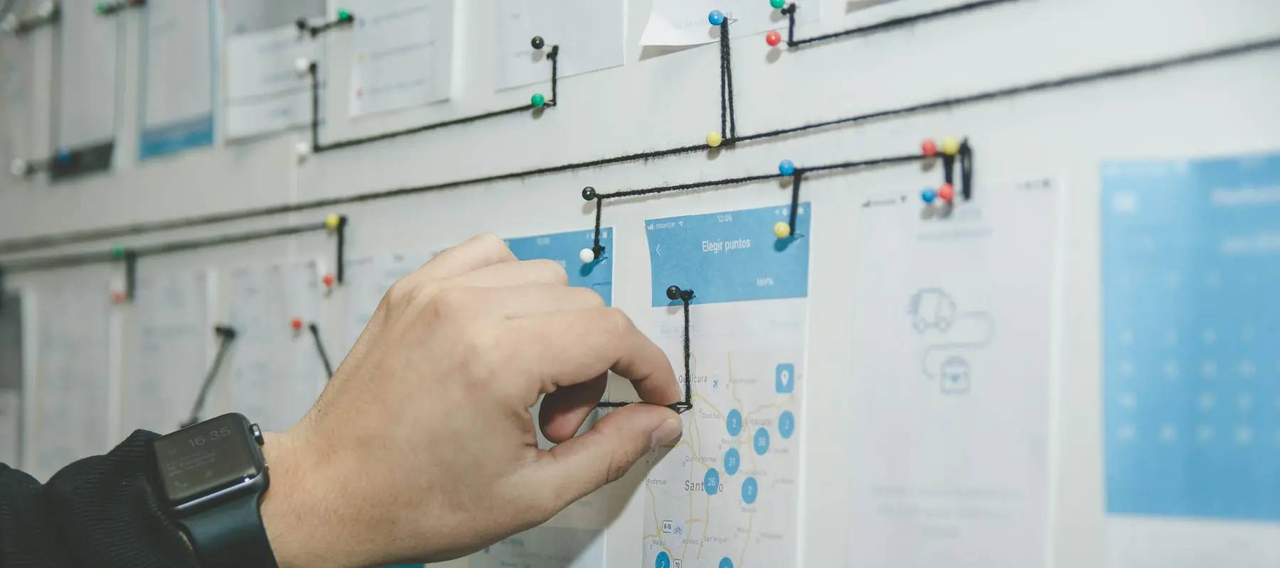 Process mapping session with sticky notes on a glass wall