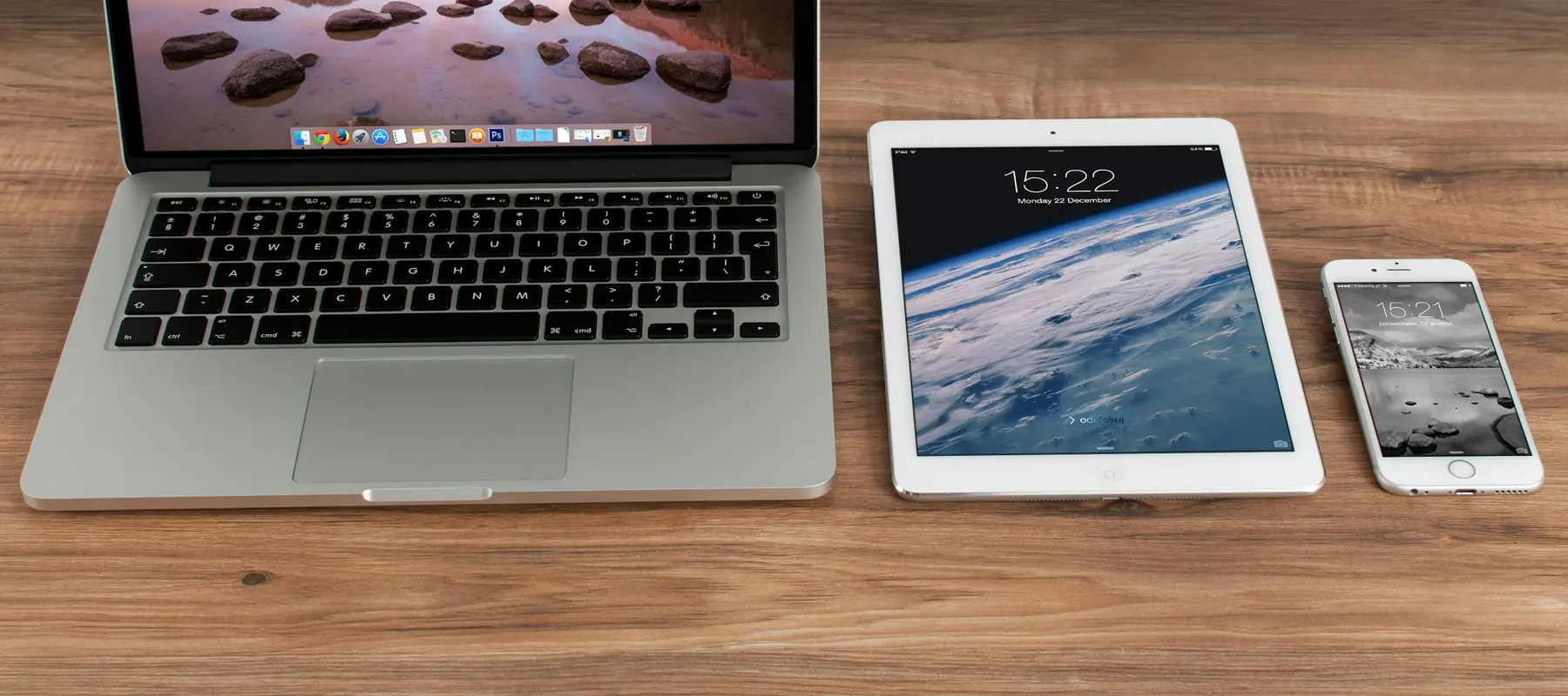 Developer testing a responsive website across phone and laptop